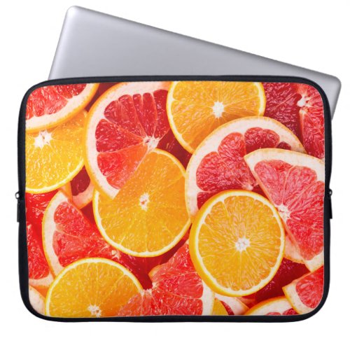 Fresh ripe orange and grapefruit backgroundbackgro laptop sleeve