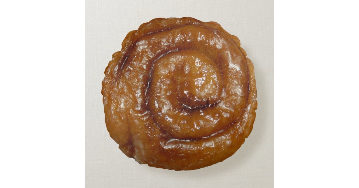 Fresh warm glazed cinnamon roll round pillow Zazzle