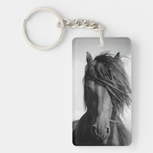 Friesian stallion in the wind. keychain