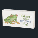 Frog Welcome to the Pad Tropical Personalized Name Wooden Box Sign<br><div class="desc">This pretty,  custom wooden box sign includes an original drawing of a frog next to your personalized text. Use the template to easily add your family name. The rest of the text can also be kept or changed.</div>
