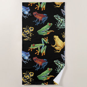 Frogs on black beach towel