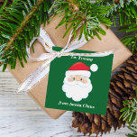 From Santa Claus Cute Custom Green Kids Christmas Favor Tags<br><div class="desc">Customize these cute Santa Claus gift tags with your own personalized text with your kids name in white script. Santa's red hat and white beard are the perfect holiday drawing on this pretty green gift tag for your presents.</div>
