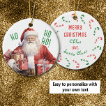From Santa Claus Personal Kid's Christmas Ceramic Ornament<br><div class="desc">Any child who loves Santa Claus will love this personalized Christmas ornament from him! The front has a watercolor image of the jolly old elf. He is smiling and carrying, of course, Holiday gifts. The green text says "HO HO HO!". The back of the ornament has text fields that you...</div>