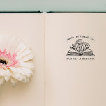FROM THE LIBRARY OF YOUR NAME OPENED BOOK FLOWERS RUBBER STAMP<br><div class="desc">Elegant bookplate STAMP with your personalized name, perfect for adding a personal touch to your cherished book collection. The bookplate showcases a gracefully curved "From the Library of" inscription at the top, a stunning illustration of an opened book with flower and leaves in the center. Replace the name below the...</div>