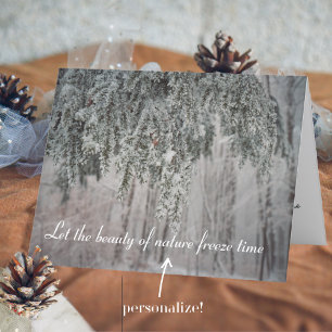 Frosted branches and a snow-covered forest holiday card