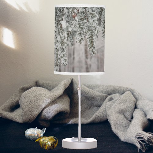 Frosted branches and a snow_covered forest table lamp