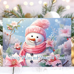 Frosty Wishes and Poinsettia Kisses Snowman Holiday Card<br><div class="desc">Send warm holiday greetings with this charming card featuring a cheerful snowman bundled in a pink scarf,  surrounded by lovely pink poinsettias. The sweet message "Frosty Wishes and Poinsettia Kisses" adds a whimsical and festive touch,  perfect for spreading joy to friends and family this Christmas season.</div>