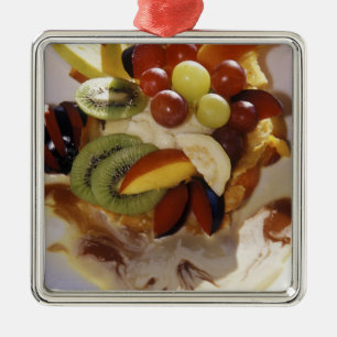 Fruit salad with ice cream. metal ornament