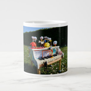 Fubbies on the piano making and dancing music. giant coffee mug
