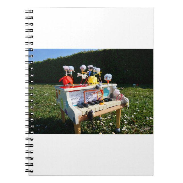 Fubbies on the piano making and dancing music. notebook (Front)
