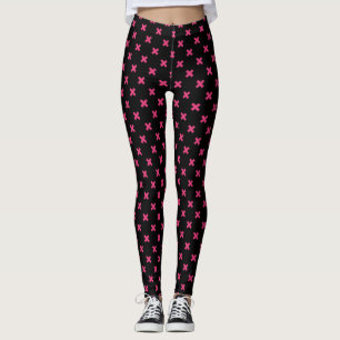 Fuchsia cross stitches on black leggings
