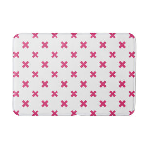 Fuchsia cross stitches on white bath mat