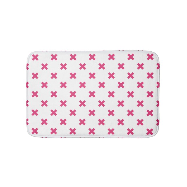 Fuchsia cross stitches on white bath mat (Front)