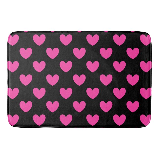 Fuchsia pink polka hearts on black bath mat (Front)