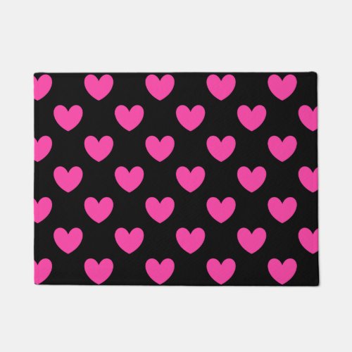Fuchsia pink polka hearts on black doormat