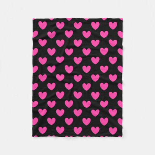 Fuchsia pink polka hearts on black fleece blanket