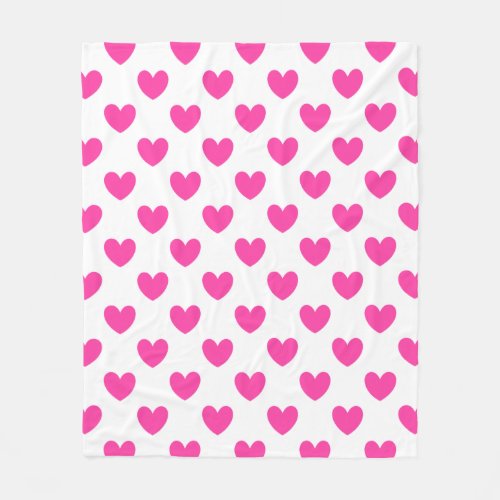 Fuchsia pink polka hearts on white fleece blanket