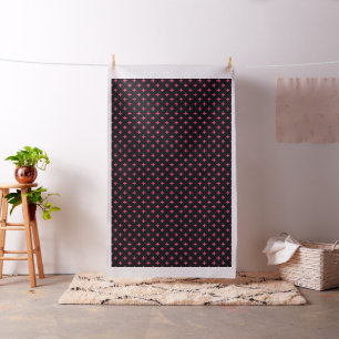 Fuchsia polka crosses on black fabric