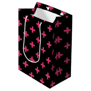 Fuchsia polka crosses on black medium gift bag