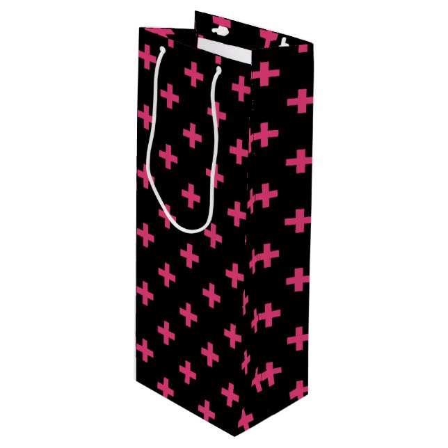 Fuchsia polka crosses on black wine gift bag (Front Angled)