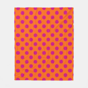 Fuchsia polka dots on orange fleece blanket