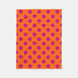 Fuchsia polka dots on orange fleece blanket