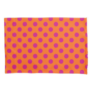 Fuchsia polka dots on orange pillow case