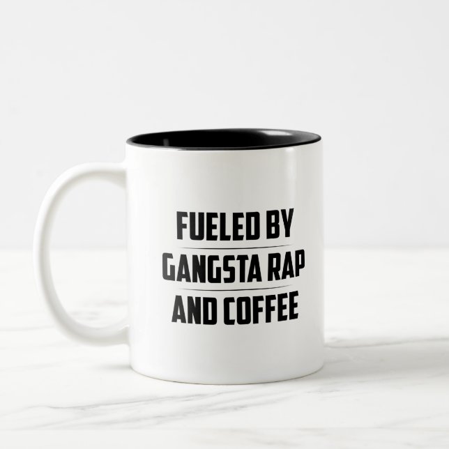 FUELED BY GANGSTA RAP AND COFFEE Two-Tone COFFEE MUG (Left)