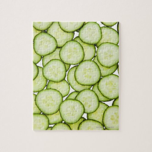 Full frame of sliced cucumber on white jigsaw puzzle