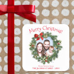 Fun Christmas Wreath Picture Frame Cute Holiday Square Sticker<br><div class="desc">These adorable stickers make great gift tags. They feature a cute design with your photo appearing in the center of a holiday wreath. The heating reads Merry Christmas in a whimsical fun red font. There is space for a short greeting,  along with your name and the year.</div>
