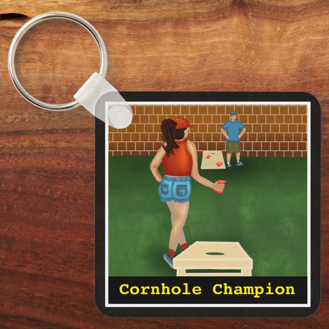 Fun Couple Playing a Game Of Cornhole | Champion Keychain (Front)