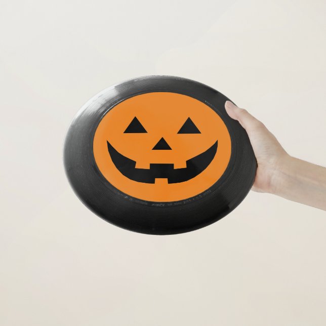 Fun orange Jack o lantern pumpkin face Halloween Wham-O Frisbee (In Hand)