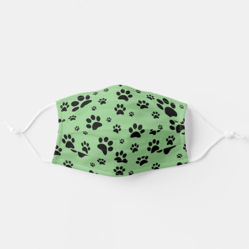 Fun Scattered Black Paw Prints on Light Green Adult Cloth Face Mask