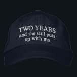 Funny 2 Year Anniversary Husband Hat Gift Cap<br><div class="desc">2nd wedding anniversary gift for him says 2 years and she still puts up with me on an embroidered ball cap hat for men celebrating two years together.</div>