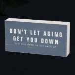 Funny Aging Getting Older Birthday Quote Wooden Box Sign<br><div class="desc">Funny quote about getting older printed on woodblock sign - makes a great birthday gift. It reads: Don't let aging get you down - it's too hard to get back up. This sign can be made in any color of your choice to match your decor. Use the message button below...</div>