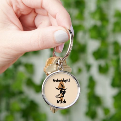 Funny Archaeologist Witch on a Broom and Trowel Keychain