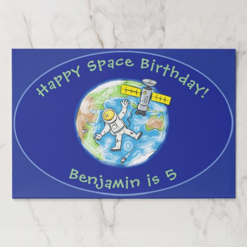 Funny astronaut with satellite over earth cartoon paper pad
