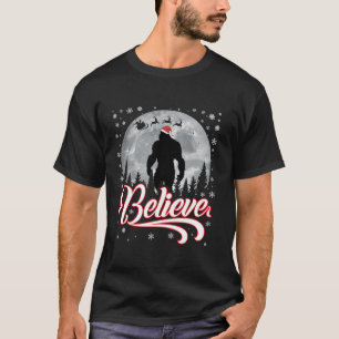 Funny Believe Christmas Bigfoot Santa Hat Moon Sce T-Shirt