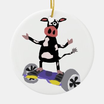 Funny Black And White Cow On Hoverboard Ceramic Ornament by tickleyourfunnybone at Zazzle