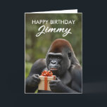 Funny Black Gorilla Holding a Gift Birthday Card<br><div class="desc">This cheerful gorilla is all smiles and ready to surprise with a special gift,  straight from the jungle.</div>