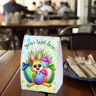 Funny Bunny biting an Easter Egg Paper Table Tent