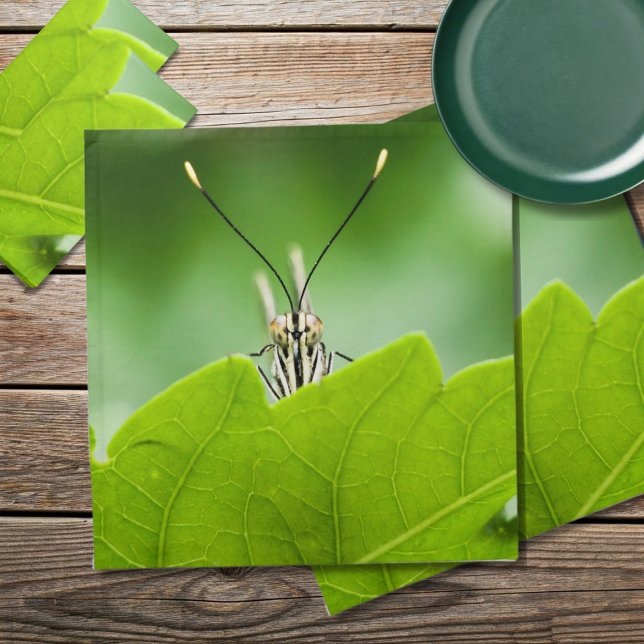 Funny Butterfly Peeks Over Leaf Cloth Napkin (A cute butterfly peeks over a vivid green leaf on these cloth napkins. Environmentally friendly gift)