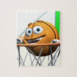 Funny Cartoon Basketball in a Hoop Jigsaw Puzzle<br><div class="desc">A great gift for a basketball fan.  A funny orange cartoon basketball drops through a basketball hoop with a big grin.</div>