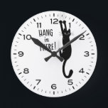 Funny Cat Hang in There Humorous Round Clock<br><div class="desc">A humorous wall clock for the home or office. Black cat hanging on. Makes a cool gift for cat lovers! Check out Jenn’s Doodle World for even more decorative clocks and animal themed home decor.</div>