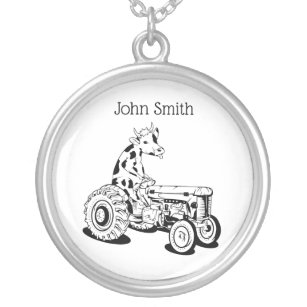 Funny cow driving a tractor silver plated necklace