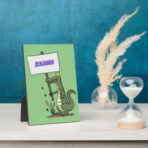 Funny crocodile aligator with sign cartoon plaque