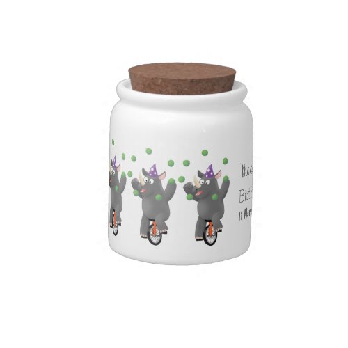 Funny cute rhino juggling on unicycle candy jar