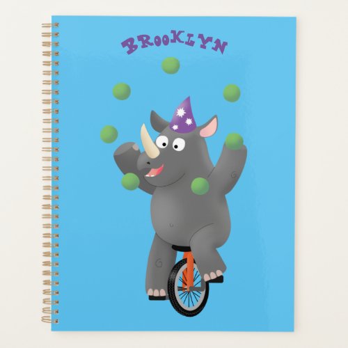 Funny cute rhino juggling on unicycle planner
