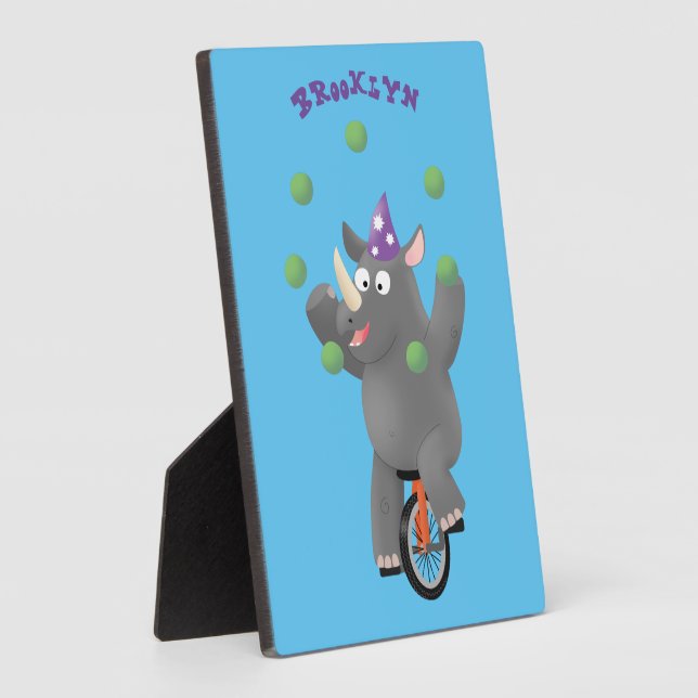 Funny cute rhino juggling on unicycle plaque (Side)