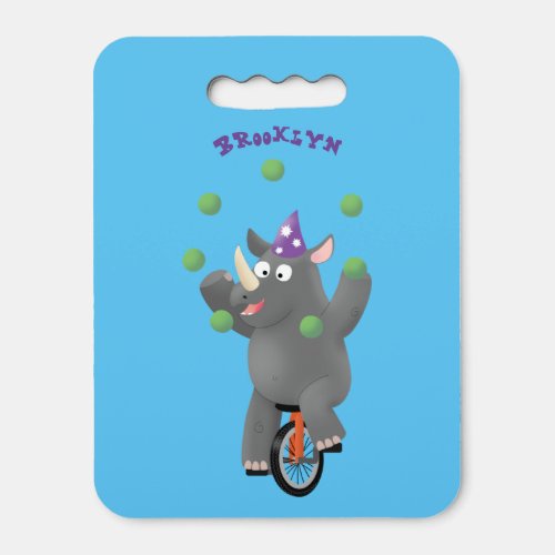 Funny cute rhino juggling on unicycle seat cushion